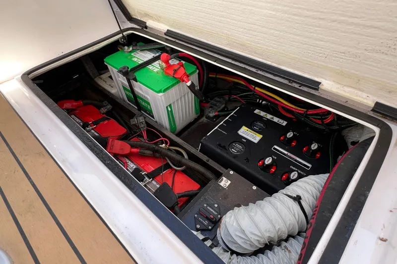  Yacht Photos Pics 2024 XO Boats EXPLR 10 S Plus battery compartment with wiring and control panel.