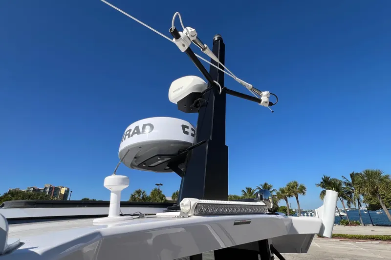  Yacht Photos Pics 2024 XO Boats EXPLR 10 S Plus radar and antenna system under clear blue sky.