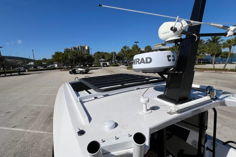  Yacht Photos Pics 2024 XO Boats EXPLR 10 S Plus with radar equipment, parked near waterfront.