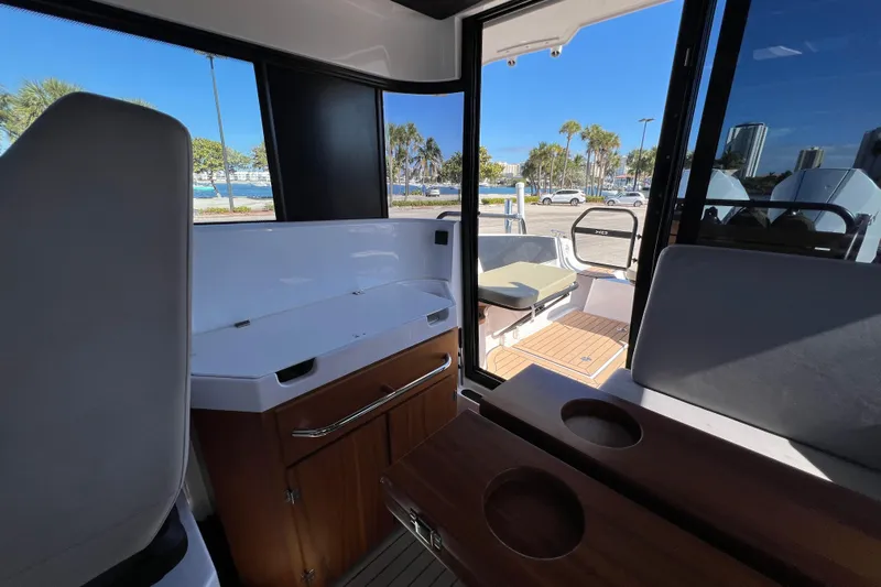  Yacht Photos Pics Interior view of 2024 XO Boats EXPLR 10 S Plus, featuring seating and cabinetry.