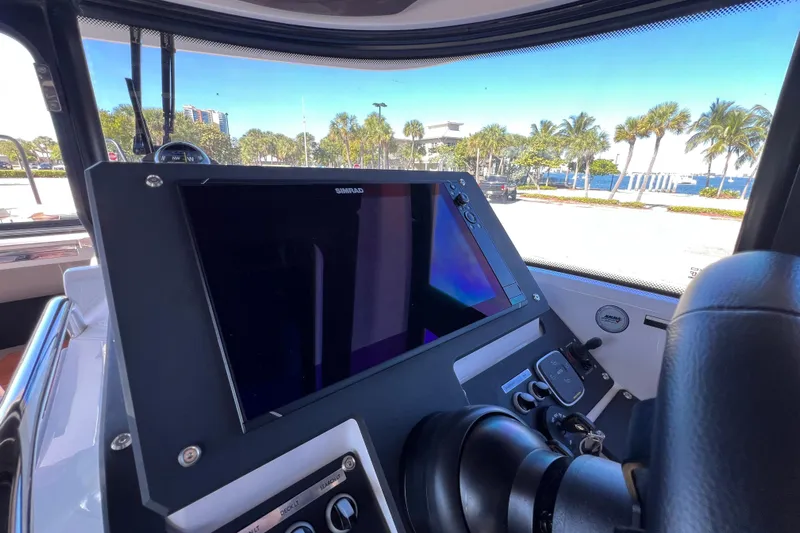  Yacht Photos Pics 2024 XO Boats EXPLR 10 S Plus dashboard with Simrad display, coastal view.