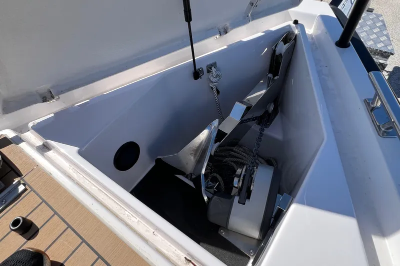  Yacht Photos Pics Anchor compartment of 2024 XO Boats EXPLR 10 S Plus, featuring anchor and rope storage.