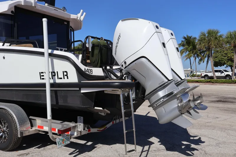  Yacht Photos Pics 2024 XO Boats EXPLR 10 S Plus with dual Mercury outboard engines on a trailer.