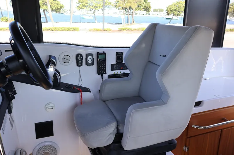 Yacht Photos Pics 2024 XO Boats EXPLR 10 S Plus helm with modern controls and comfortable seating.
