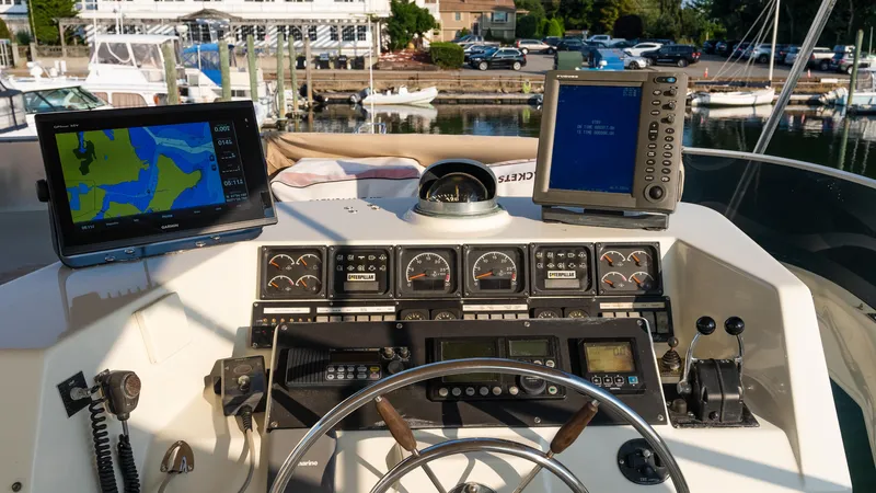  Yacht Photos Pics 1996 Tollycraft 57 Pilothouse Motor Yacht helm with navigation equipment and controls.