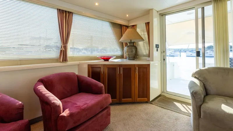  Yacht Photos Pics Luxurious interior of 1996 Tollycraft 57 Pilothouse Motor Yacht with plush seating and elegant decor.