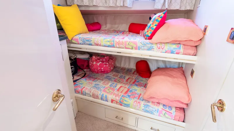  Yacht Photos Pics Bunk beds with colorful bedding in 1996 Tollycraft 57 Pilothouse Motor Yacht cabin.