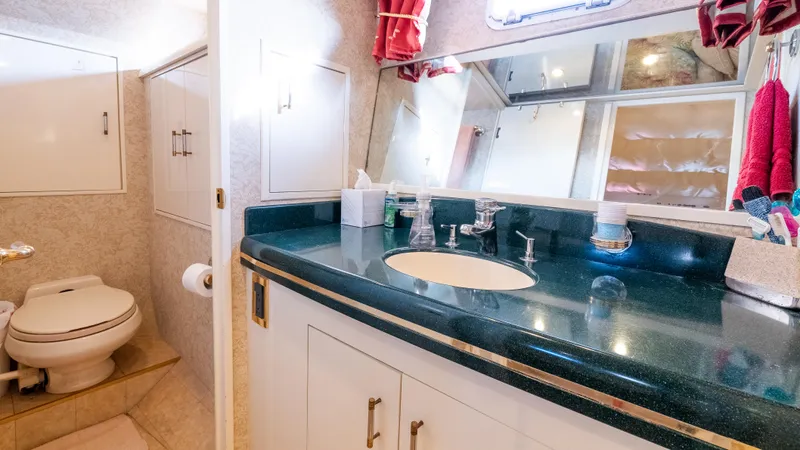  Yacht Photos Pics Bathroom interior of 1996 Tollycraft 57 Pilothouse Motor Yacht with modern fixtures.