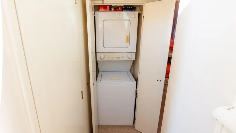  Yacht Photos Pics Stacked washer and dryer in 1996 Tollycraft 57 Pilothouse Motor Yacht laundry area.