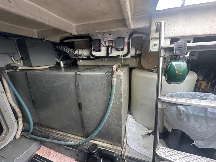  Yacht Photos Pics Engine room of 1996 Tollycraft 57 Pilothouse Motor Yacht with equipment and storage tanks.