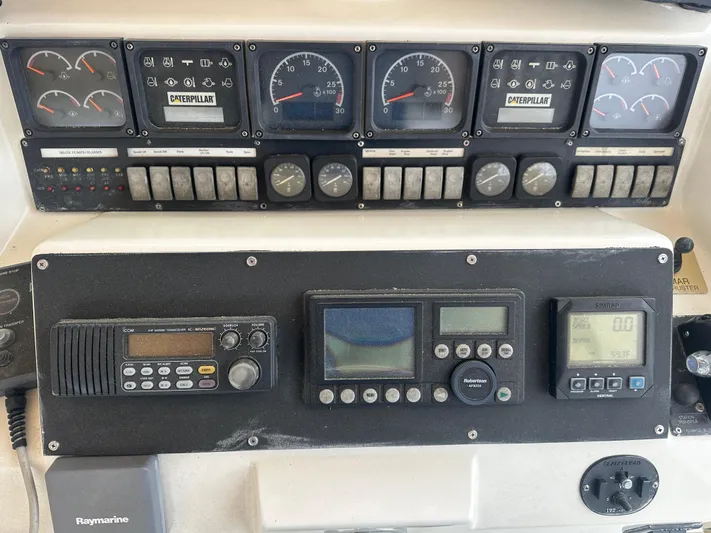  Yacht Photos Pics Control panel of a 1996 Tollycraft 57 Pilothouse Motor Yacht with various gauges and instruments.