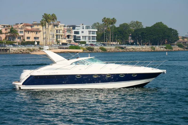 Back Up Plan Yacht Photos Pics Luxury 2001 Fairline 43 yacht cruising near waterfront homes and palm trees.