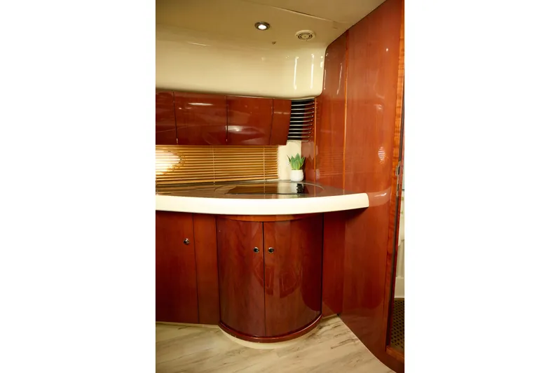 Back Up Plan Yacht Photos Pics Luxurious interior of 2001 Fairline 43 yacht with polished wood cabinetry.