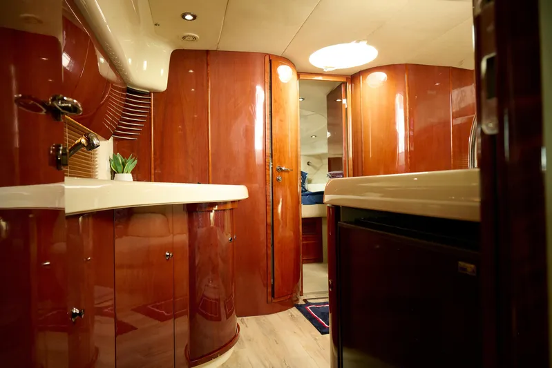 Back Up Plan Yacht Photos Pics Luxurious interior of a 2001 Fairline 43 yacht with polished wood finishes.