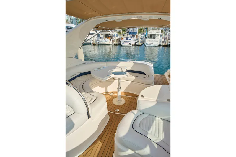 Back Up Plan Yacht Photos Pics Luxurious 2001 Fairline 43 yacht interior with elegant seating and marina view.