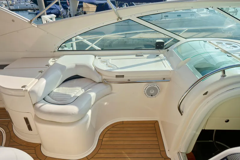 Back Up Plan Yacht Photos Pics Luxurious 2001 Fairline 43 yacht interior with white seating and wooden flooring.