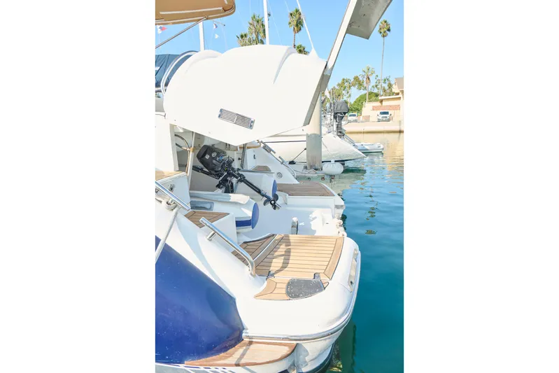 Back Up Plan Yacht Photos Pics 2001 Fairline 43 yacht with open engine compartment, docked in a sunny marina.