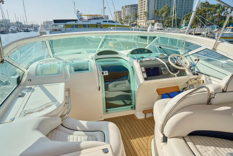 Back Up Plan Yacht Photos Pics Interior view of 2001 Fairline 43 yacht cockpit with modern controls and seating.