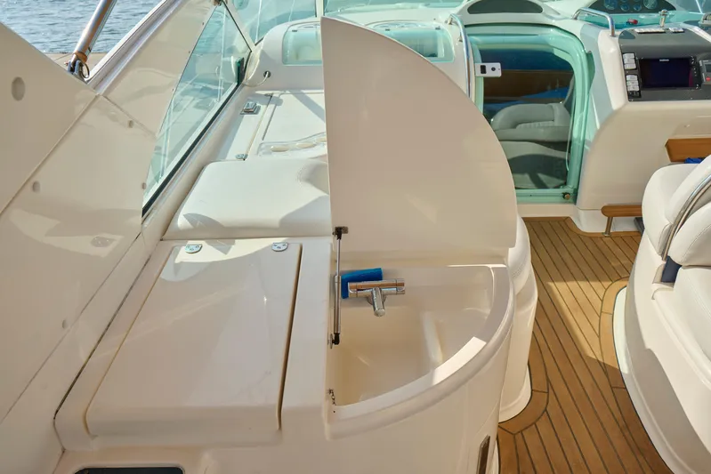 Back Up Plan Yacht Photos Pics Interior of 2001 Fairline 43 yacht featuring a compact sink and wooden flooring.