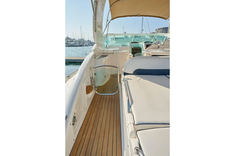 Back Up Plan Yacht Photos Pics 2001 Fairline 43 yacht deck with teak flooring and cushioned seating.