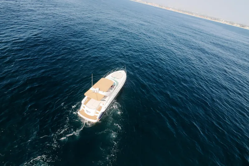 Back Up Plan Yacht Photos Pics Aerial view of 2001 Fairline 43 yacht cruising on open sea.