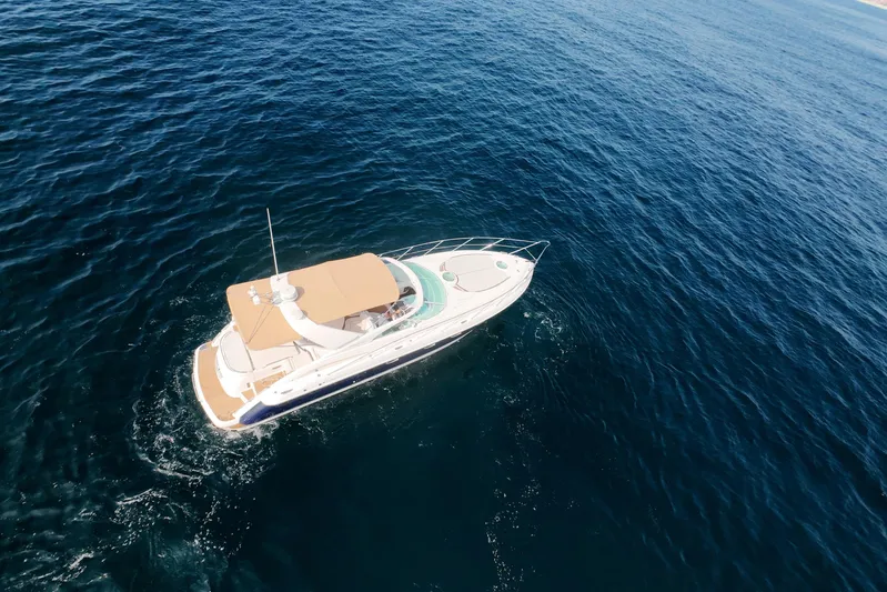 Back Up Plan Yacht Photos Pics Aerial view of 2001 Fairline 43 yacht cruising on open blue sea.