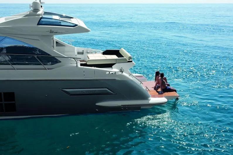 Treasure X Yacht Photos Pics Azimut 55S Yacht 2015 on open sea with people on platform.