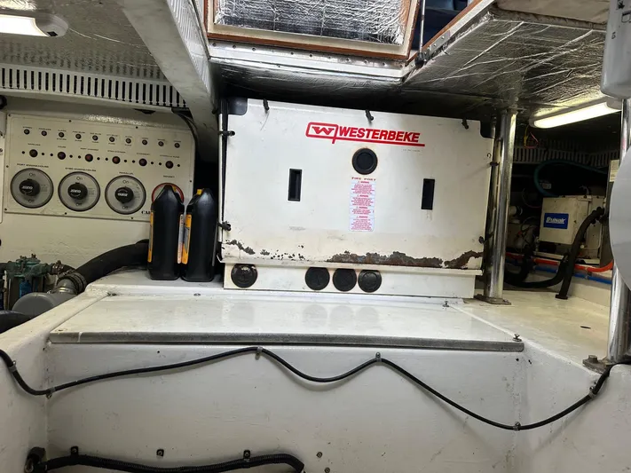  Yacht Photos Pics Engine room of a 2000 Cabo Convertible with Westerbeke generator and control panel.