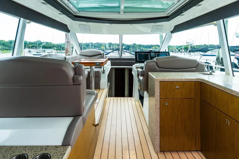  Yacht Photos Pics Interior of 2013 Cruisers Yachts 48 Cantius with modern helm and seating.