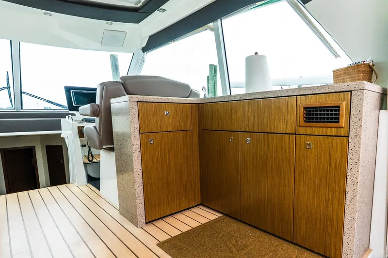  Yacht Photos Pics Interior of 2013 Cruisers Yachts 48 Cantius with wooden cabinetry and modern design.