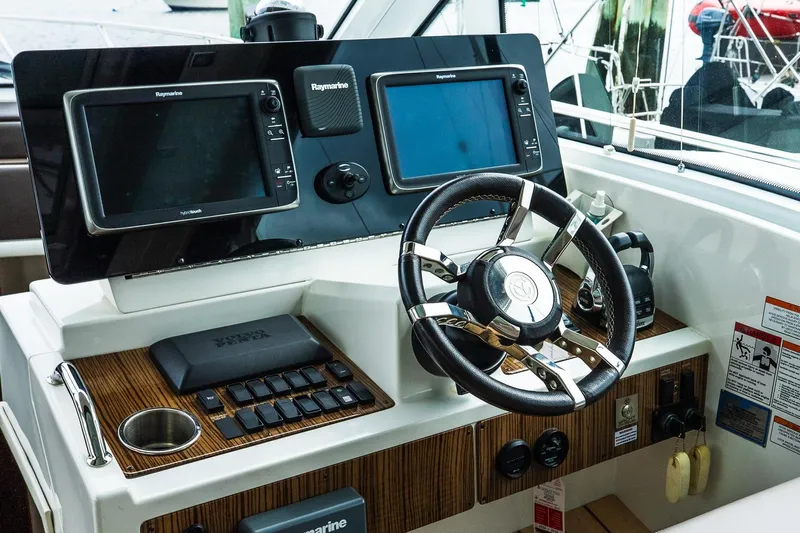 Yacht Photos Pics Helm of 2013 Cruisers Yachts 48 Cantius with Raymarine navigation displays.