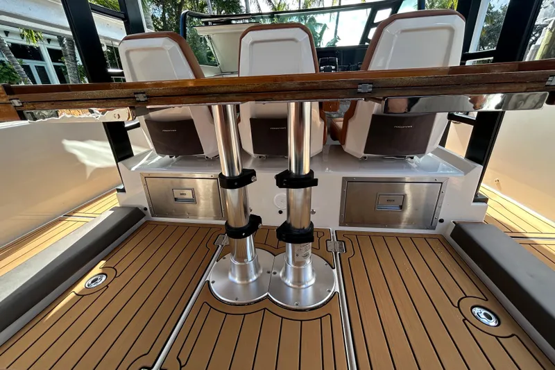  Yacht Photos Pics 2018 Axopar 37 SUN TOP BRABUS interior with teak flooring and modern seating.