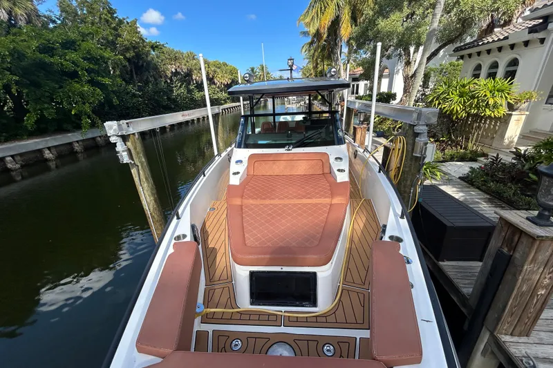  Yacht Photos Pics 2018 Axopar 37 SUN TOP BRABUS docked, featuring luxurious seating and sleek design.