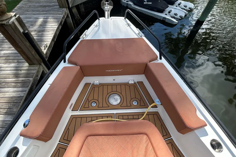  Yacht Photos Pics 2018 Axopar 37 SUN TOP BRABUS boat interior with brown seating and wood deck.