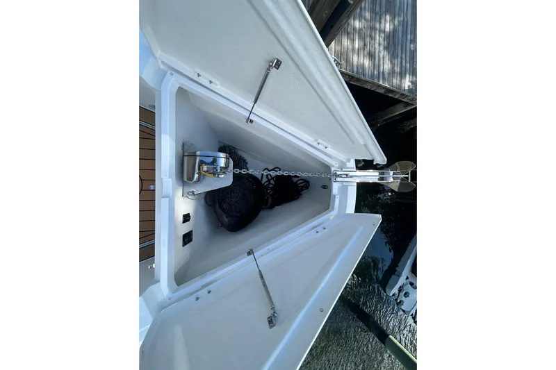  Yacht Photos Pics Anchor compartment of 2018 Axopar 37 SUN TOP BRABUS boat, featuring chain and winch.
