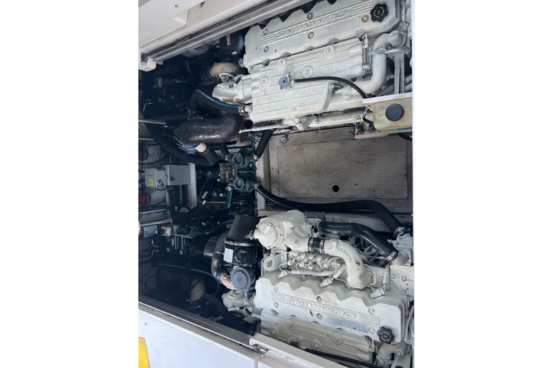  Yacht Photos Pics Engine compartment of a 2010 Sea Ray 450 Sundancer boat, featuring dual Cummins engines.