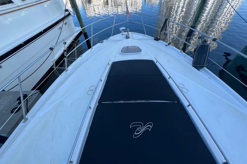  Yacht Photos Pics 2010 Sea Ray 450 Sundancer yacht deck with sleek design and waterfront view.