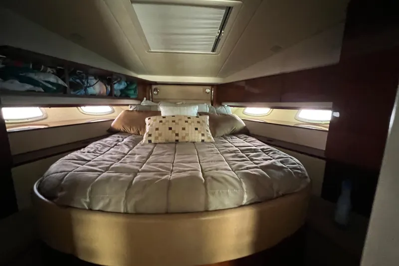  Yacht Photos Pics Luxurious cabin interior of 2010 Sea Ray 450 Sundancer yacht with cozy bed.