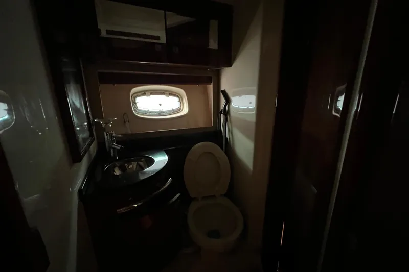  Yacht Photos Pics Bathroom interior of 2010 Sea Ray 450 Sundancer yacht with sink and toilet.