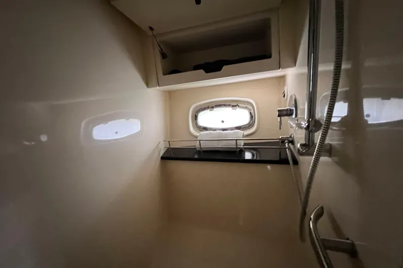  Yacht Photos Pics Interior of 2010 Sea Ray 450 Sundancer yacht bathroom with shower and window.