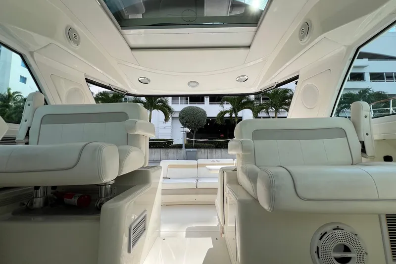  Yacht Photos Pics Interior view of 2010 Sea Ray 450 Sundancer yacht with white seating and modern design.