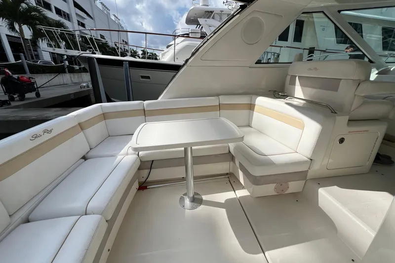  Yacht Photos Pics Luxurious 2010 Sea Ray 450 Sundancer yacht interior with elegant seating and table.