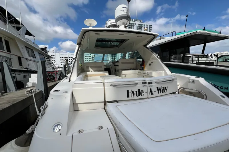  Yacht Photos Pics 2010 Sea Ray 450 Sundancer yacht docked, featuring spacious deck and modern design.