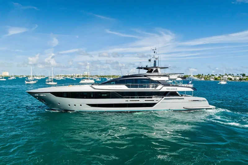 Tenacious Yacht Photos Pics Luxurious 2025 Riva 130' Bellissima yacht cruising in clear blue waters.