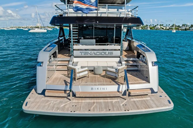 Tenacious Yacht Photos Pics Luxury yacht Riva 130' Bellissima 2025 on serene blue waters, rear view.