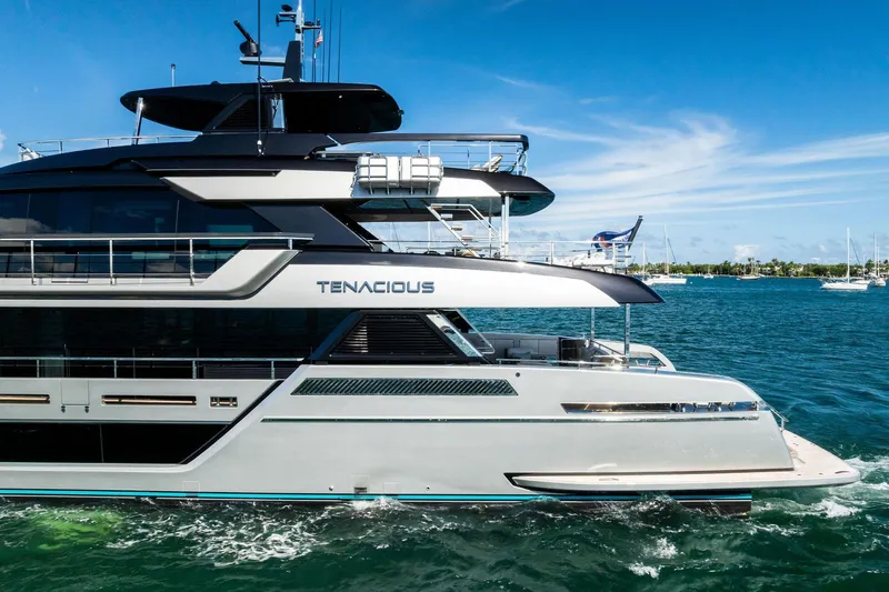 Tenacious Yacht Photos Pics 2025 Riva 130' Bellissima yacht cruising on blue ocean waters.