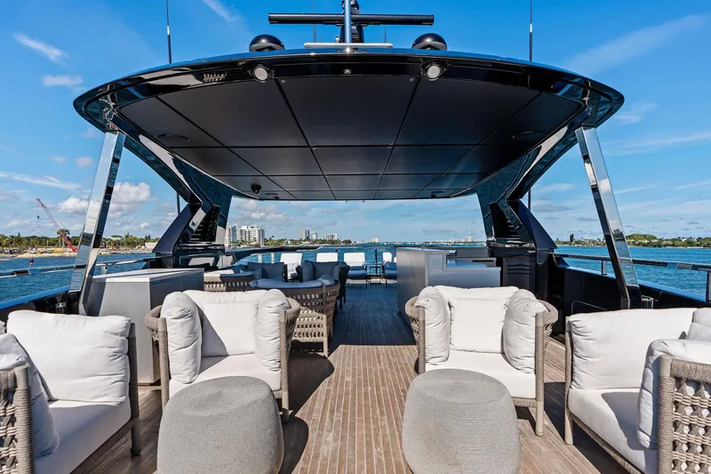 Tenacious Yacht Photos Pics Luxurious deck of 2025 Riva 130' Bellissima yacht with elegant seating and ocean view.
