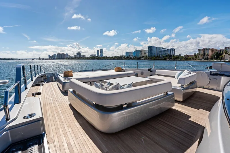 Tenacious Yacht Photos Pics Luxurious deck of 2025 Riva 130' Bellissima yacht with city skyline view.