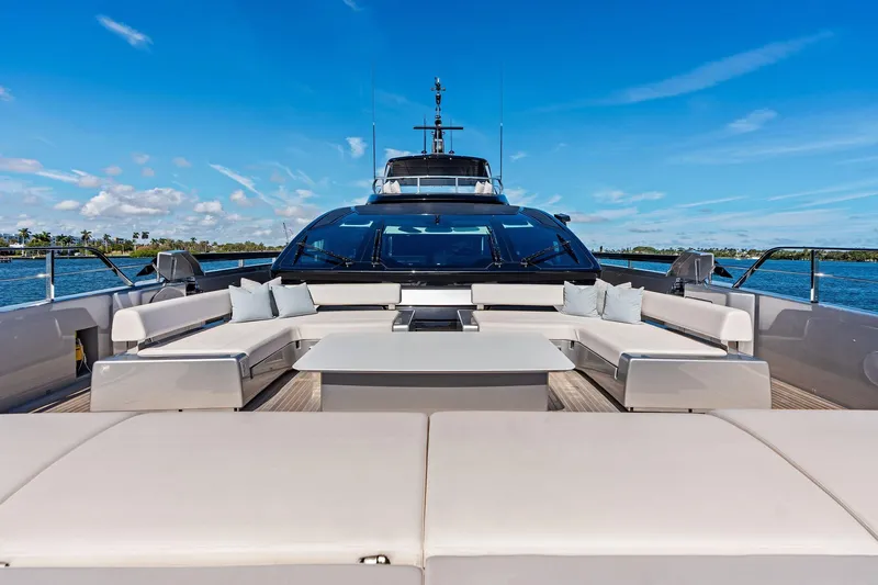 Tenacious Yacht Photos Pics Luxurious 2025 Riva 130' Bellissima yacht deck with elegant seating and ocean view.