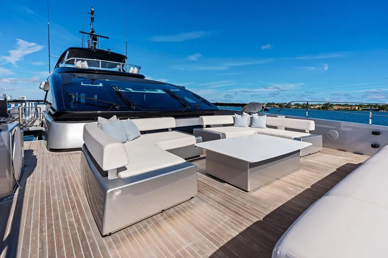 Tenacious Yacht Photos Pics Luxurious 2025 Riva 130' Bellissima yacht deck with modern seating and ocean view.